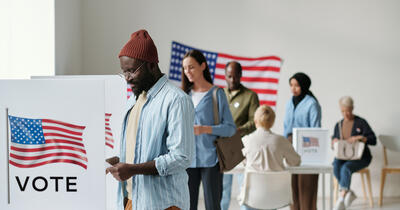 Voters of color at the voting booths