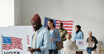 Voters of color at the voting booths