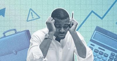 Black worker in the foreground looking frustrated, with economic indicators floating in the background