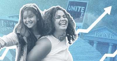 A woman carrying a child on her back