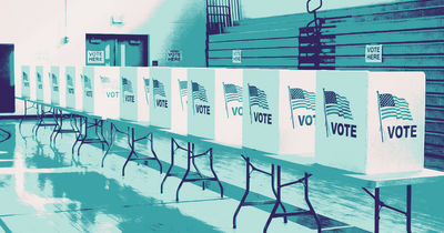 Row of  empty voting booths in a school gym