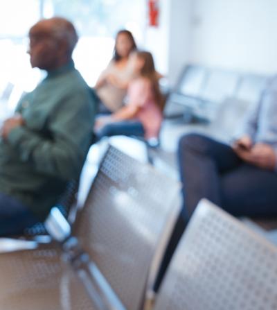 Defocused image of people sitting in an agency waiting room