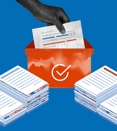 Image of a hand lowering a voter registration sheet into an orange box with stacks of voter registration papers on both sides