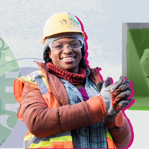 Black construction worker smiling at the camera with hands clasped