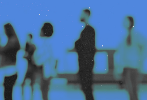 Blurry blue image of people standing in line