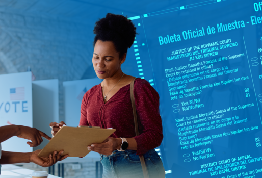 Black woman receiving a multilingual ballot at a polling center