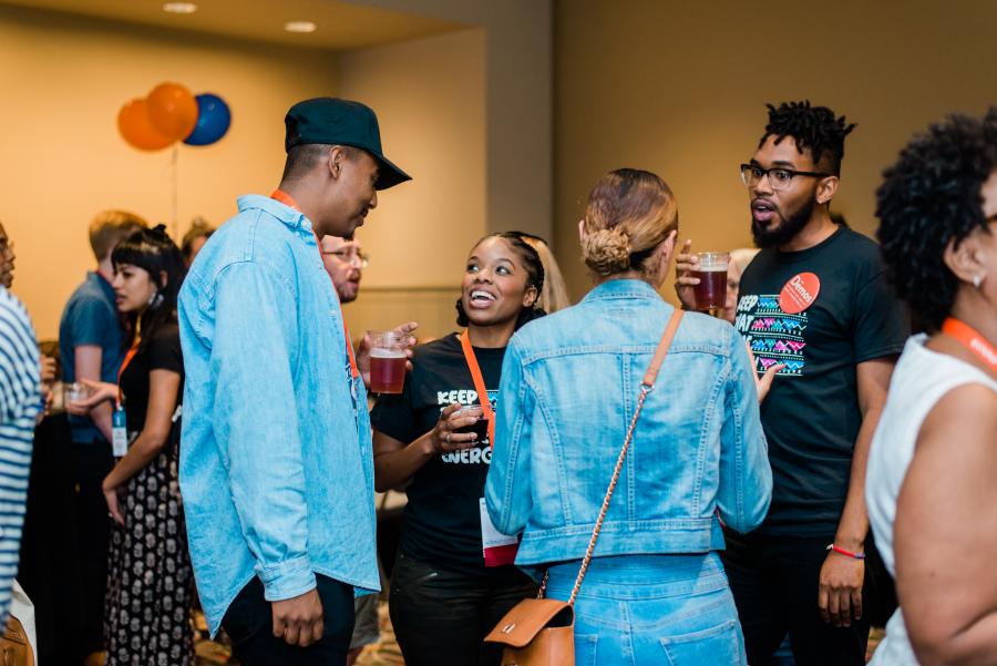 Shanaé Bass and David Perrin of Demos talk with Netroots attendees at the Demos happy hour follow the KTSE panel